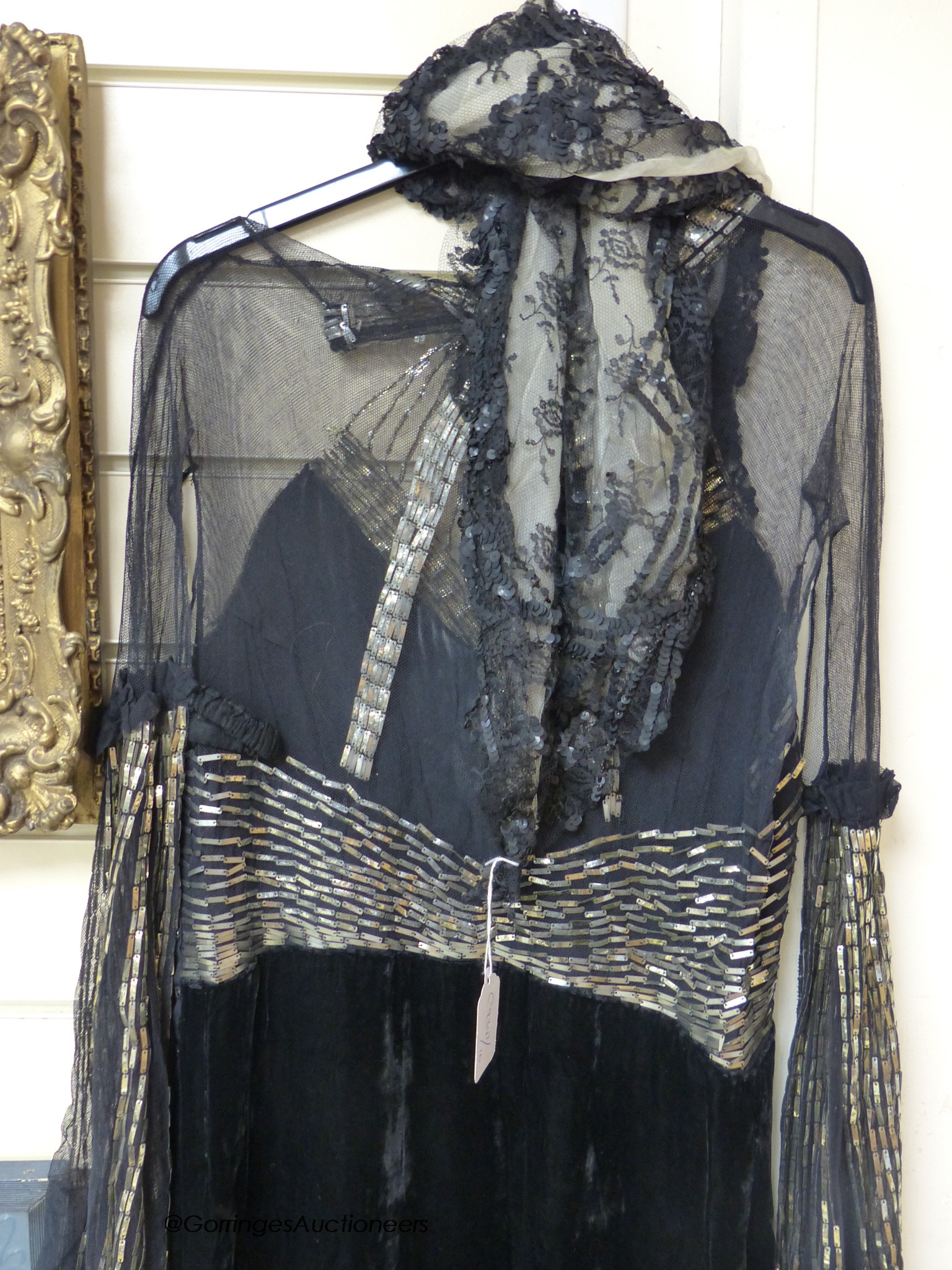 A late 1930's black silk velvet and silver evening dress and an Edwardian black sequin triangular shawl